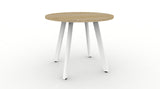 A modern round meeting table with a melamine top and white 45-degree angled legs, part of the Deluxe Eternity range.